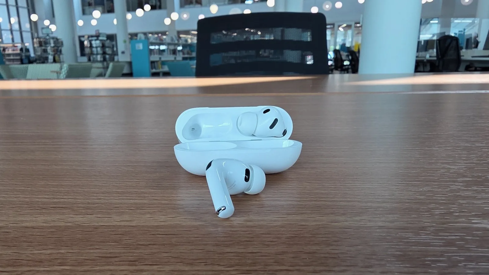 The sleek Apple AirPods Pro 3 with foam-filled ear tips, shown in a close-up, highlighting their noise-canceling feature.