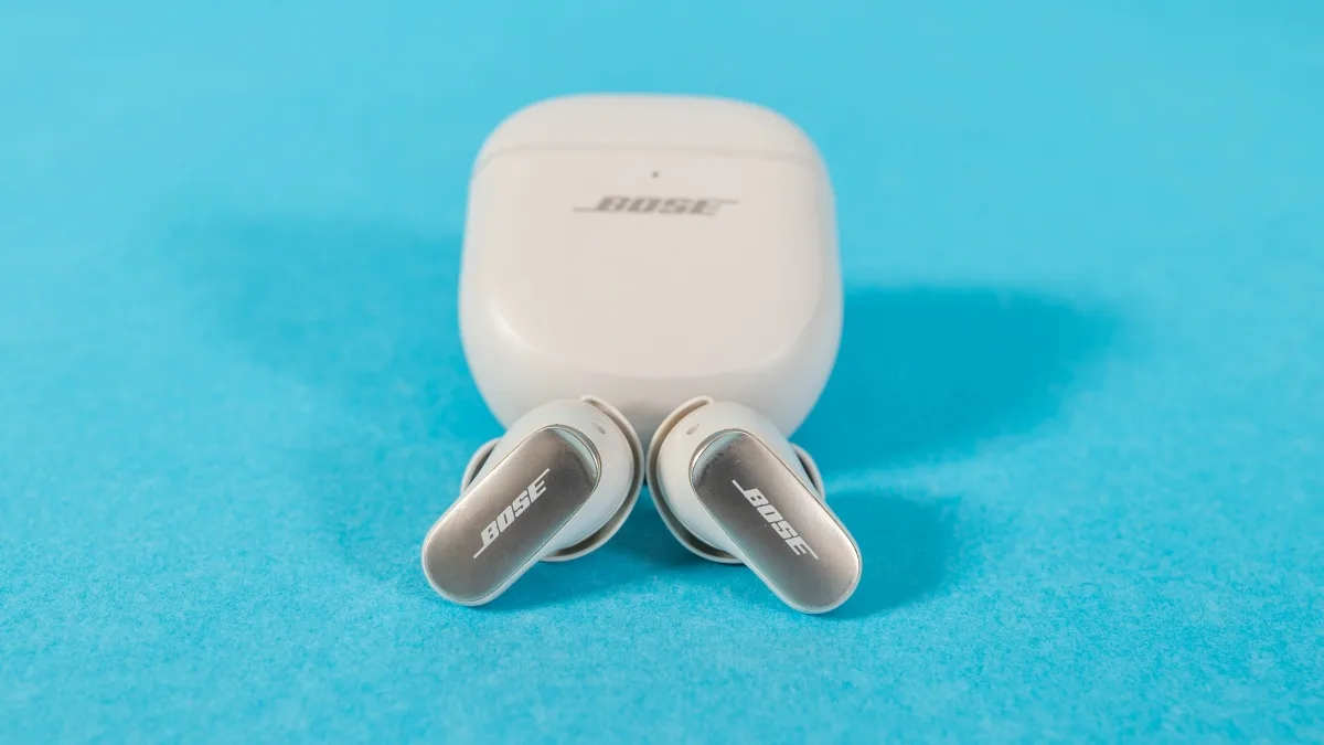 Bose QuietComfort Ultra Earbuds in sleek black with a compact charging case, featuring Bose's renowned noise cancellation tec