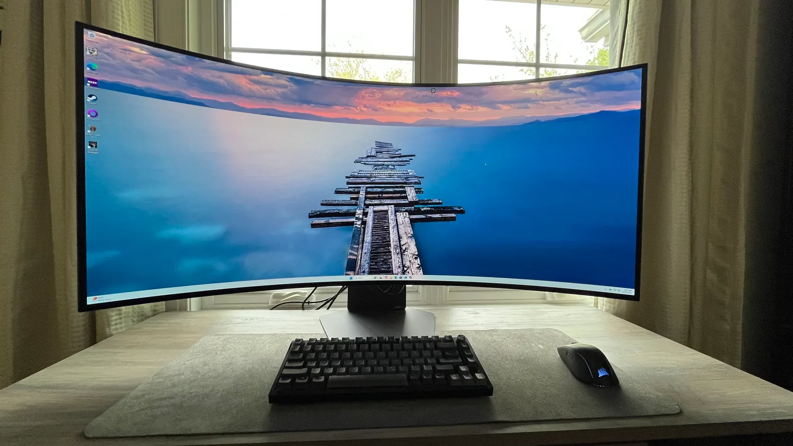 LG UltraGear 45GX950A curved ultrawide gaming monitor with slim bezels on desk