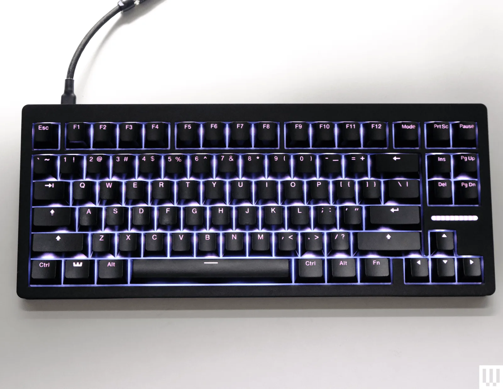 The Wooting 80HE keyboard with its premium zinc alloy case and distinctive layout, showcasing rapid response Hall Effect swit